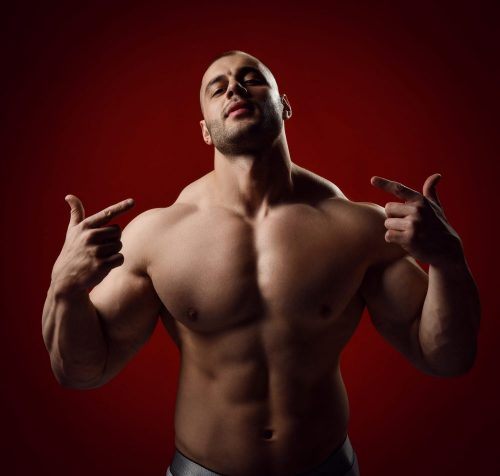 Strong,Muscular,Arrogant,Man,,Bodybuilder,With,Perfect,Body,Standing,With